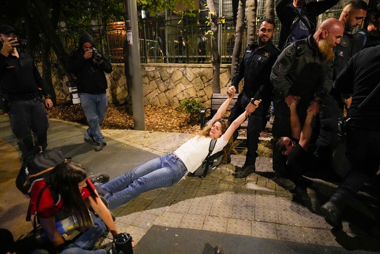 Police disperse protesters near the prime minister's residence in Jerusalem on Monday.