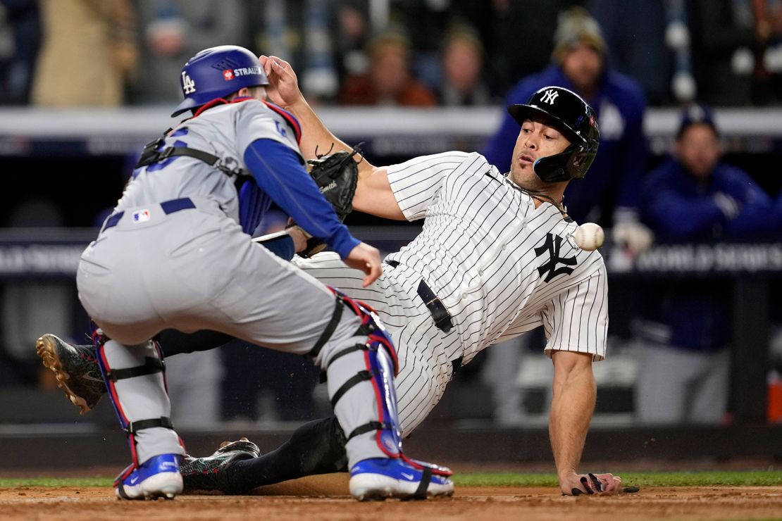 New York Yankees' Giancarlo Stanton was tagged out at home plate in the fourth inning.