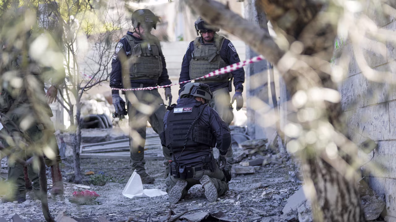 Members of the Israeli police bomb squad work at the site where one person was killed after a projectile launched from Lebanon slammed into Maalot-Tarshiha, Israel, on October 29.