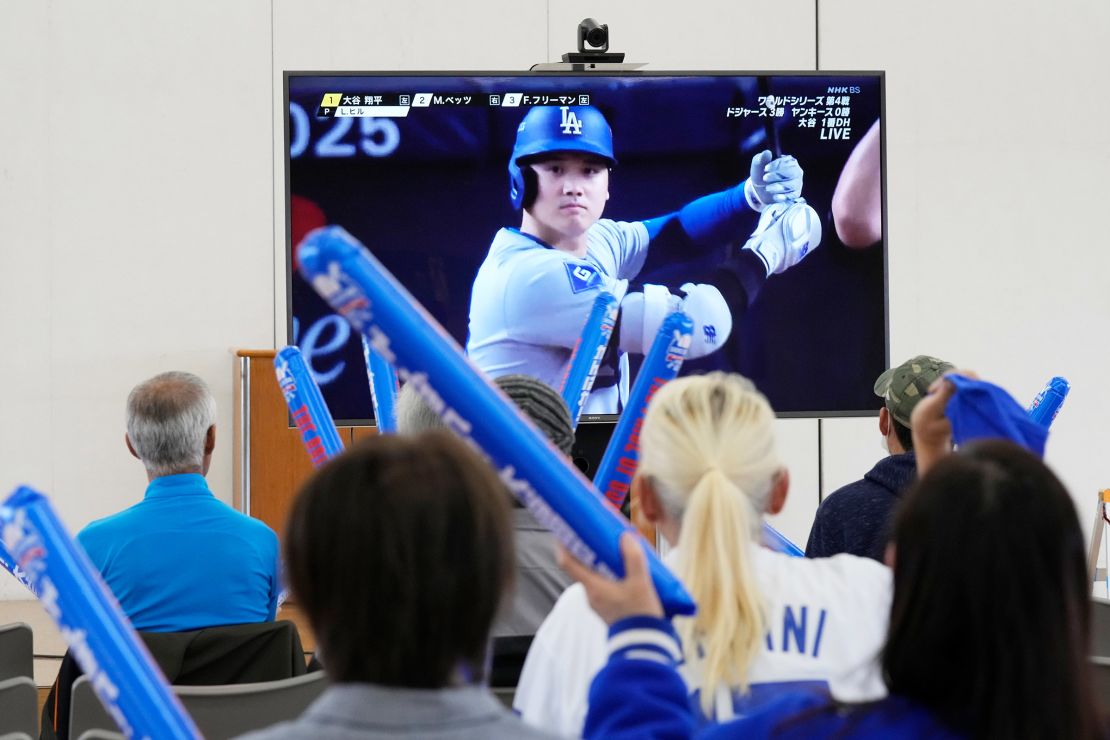 People watch Shohei Ohtani of the Los Angeles Dodgers during Game 4 of the Baseball World Series between the Dodgers and the New York Yankees during a public viewing event in Ohtani's hometown of Oshu, northeastern Japan on October 30, 2024.