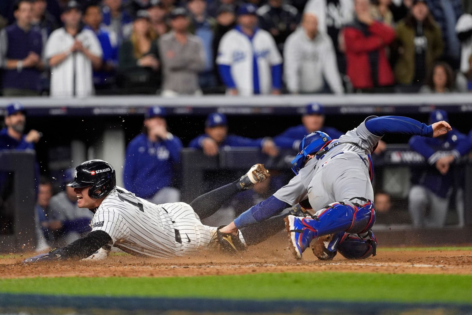 Volpe slides into home plate, scoring a run in the eighth inning.