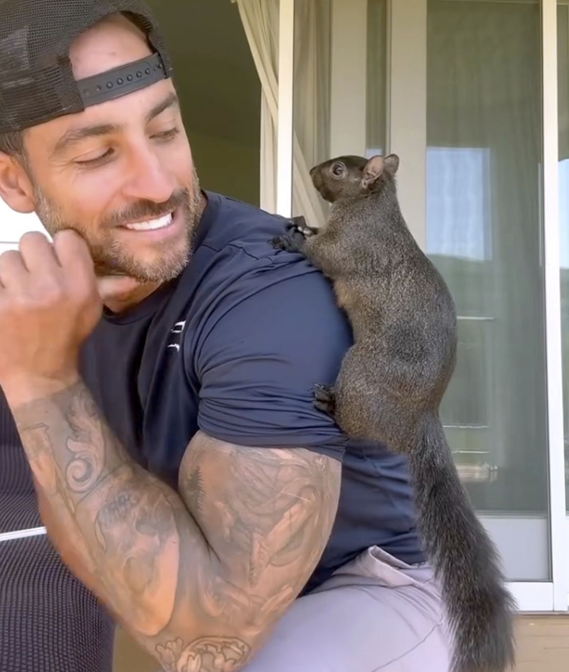 This undated picture of Mark Longo shows him with his pet squirrel Peanut.