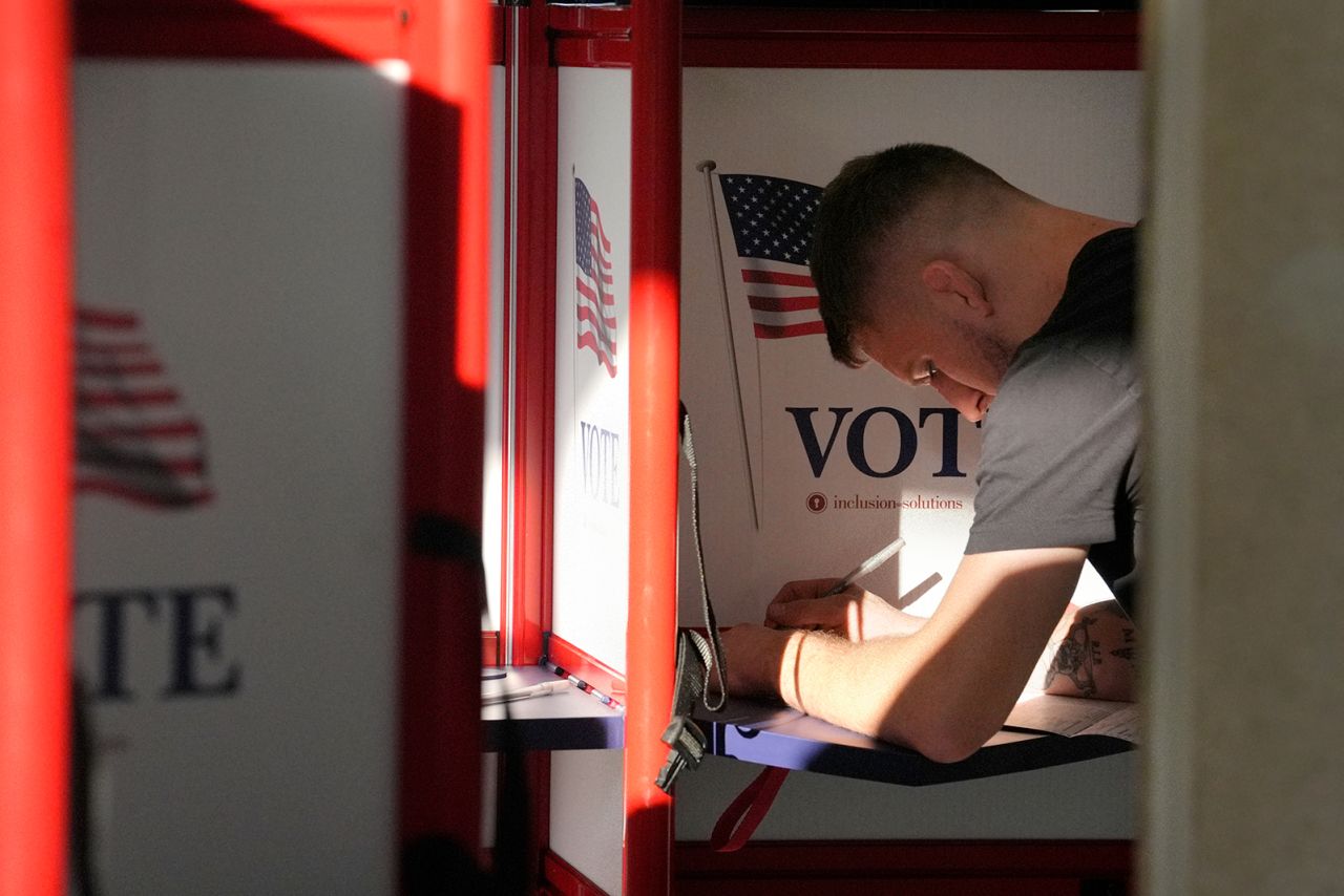 A voter fills out their their ballot during early voting in the general election in Fall River, Massachusetts, on November 1.