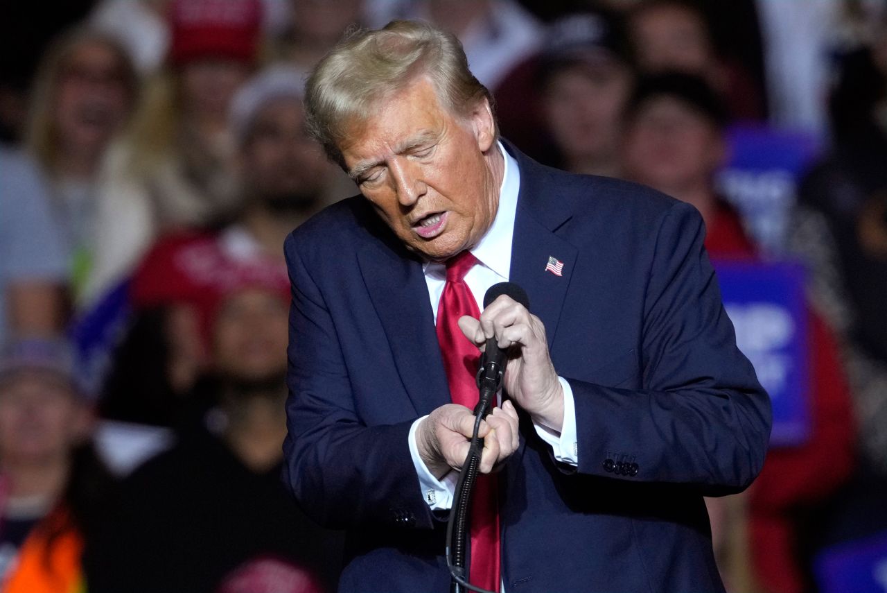 Former President Donald Trump unhooks the microphone as he speaks at a campaign event on Friday, November 1, in Milwaukee.