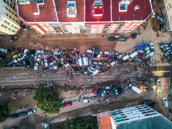 Vehicles remain piled up in the streets of Alfafar on Saturday.