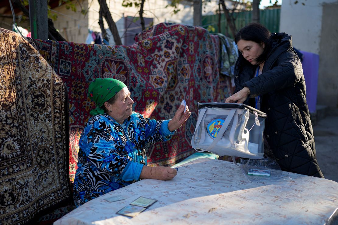 A woman casts her vote in a mobile ballot box in Ciopleni, Moldova, on Sunday.