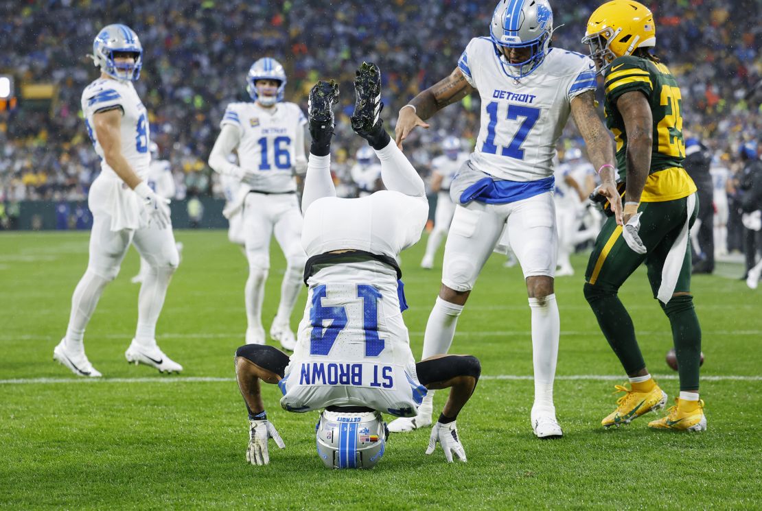 St. Brown (No. 14) scored a touchdown for the Lions on the first drive of the game.