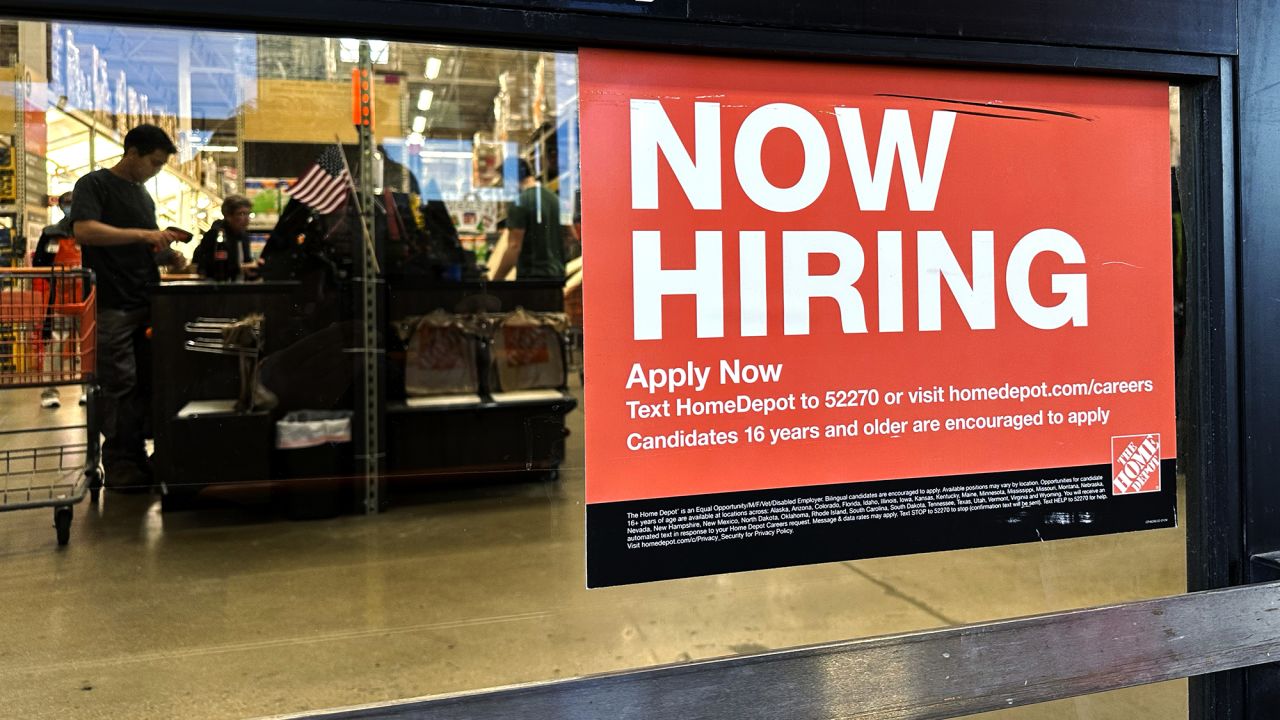 A hiring sign is displayed at a retail store in Mount Prospect, Ill., Saturday, Nov. 2, 2024.