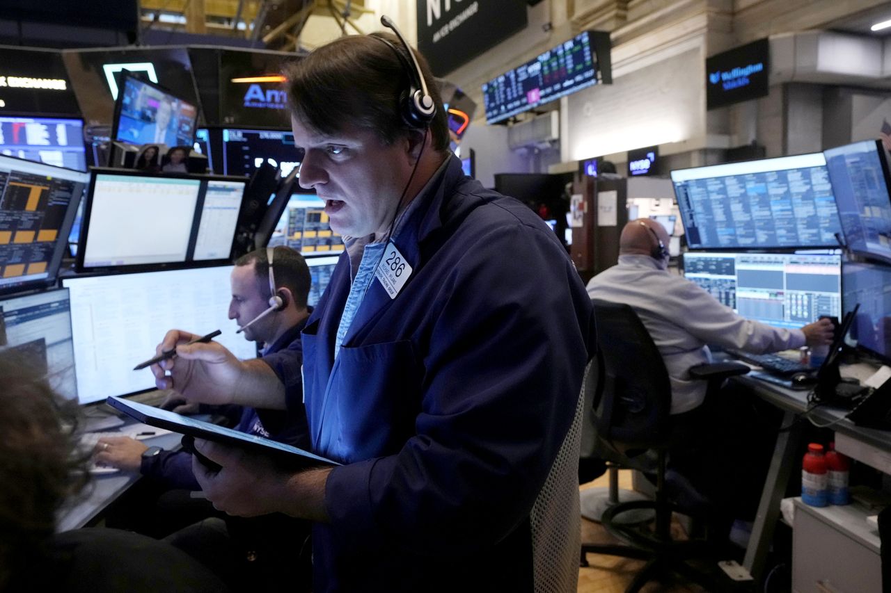 Trader Michael Milano works with colleagues on the floor of the New York Stock Exchange, on November 4.