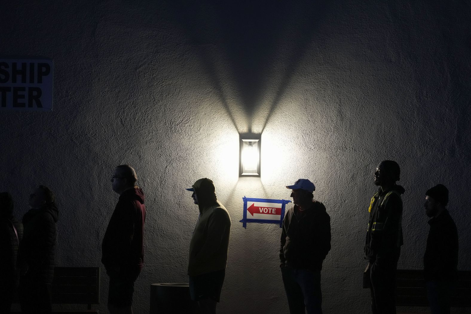 Voters stand in line outside a polling place in Phoenix on Tuesday.