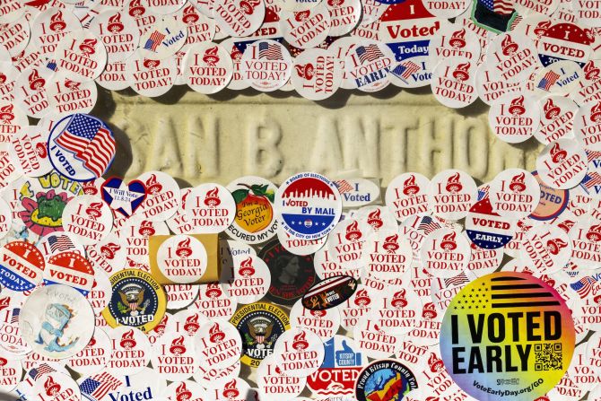 The headstone of women's suffragist Susan B. Anthony is covered in "I voted" stickers at the Mount Hope Cemetery in Rochester, New York, on Tuesday.