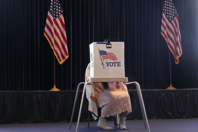 A voter fills out a ballot at the Ronald Reagan Presidential Library on Tuesday.