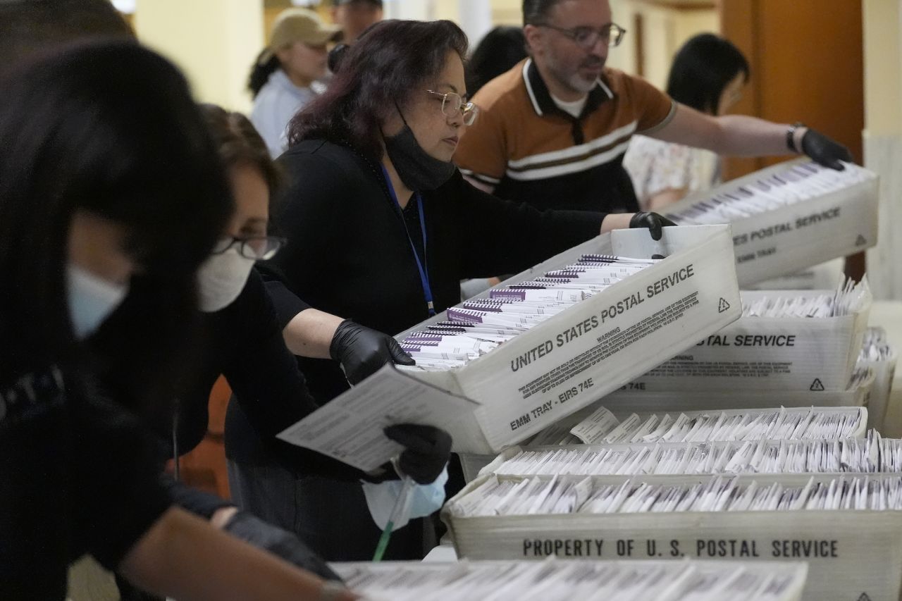 Election workers in San Francisco gather ballots at City Hall.