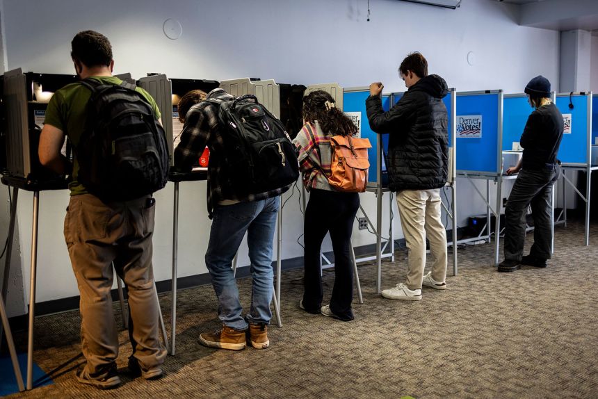 Voters cast their ballots in Denver on Election Day, November 5, 2024.