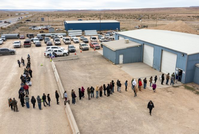 Voters wait in line to cast their ballots on the Navajo Nation reservation in Chinle, Arizona, on Tuesday.