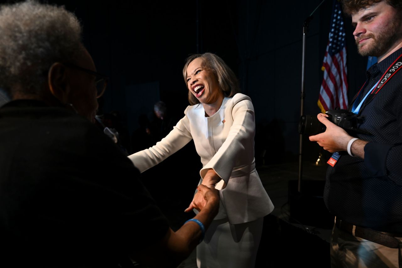 Rep. Lisa Blunt Rochester shakes hands with supporters during an election night watch party in Wilmington, Delaware, on Tuesday.