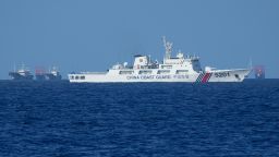 A Chinese coast guard vessel stays beside suspected Chinese militia ships near Thitu island, locally called Pag-asa island on November 6, 2024 ahead of a Philippine military multi-service joint exercise at the disputed South China Sea, Philippines.