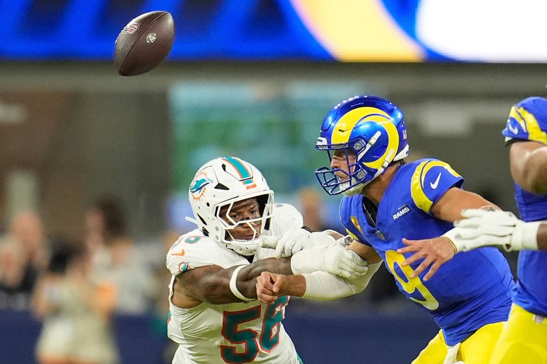 Miami Dolphins linebacker Quinton Bell forces Los Angeles Rams quarterback Matthew Stafford to fumble the ball during the first half of the game.