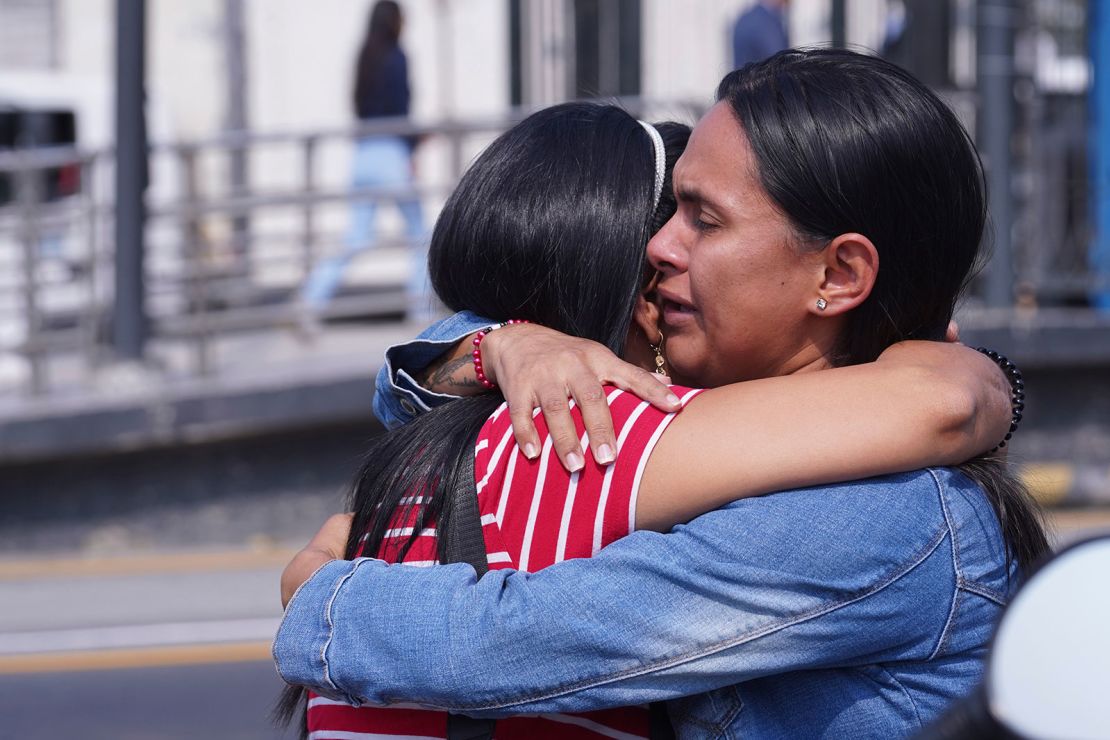 Inmates' relatives embrace outside the Litoral Penitentiary in the coastal city of Guayaquil, Ecuador, on Nov. 12, 2024, after a fight among inmates left more than a dozen dead.