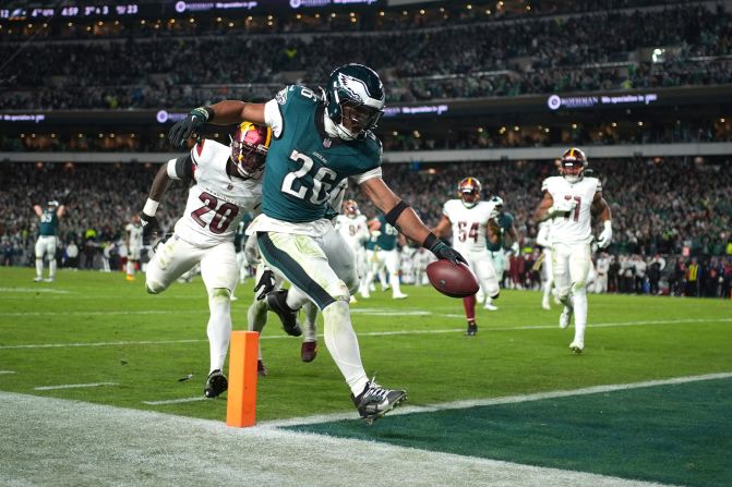 Philadelphia Eagles running back Saquon Barkley scores during his team's <a href="https://www.cnn.com/2024/11/15/sport/eagles-commanders-nfl-tnt-spt-intl/index.html">26-18 victory</a> over the Washington Commanders in Philadelphia on Thursday, November 14.