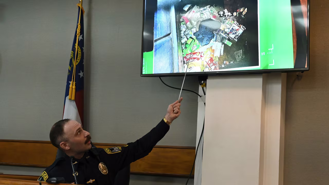Athens-Clarke County Police Officer Zachary Davis points out the jacket he collected from a dumpster on the witness stand during the trial of Jose Ibarra on Friday, Nov. 15.