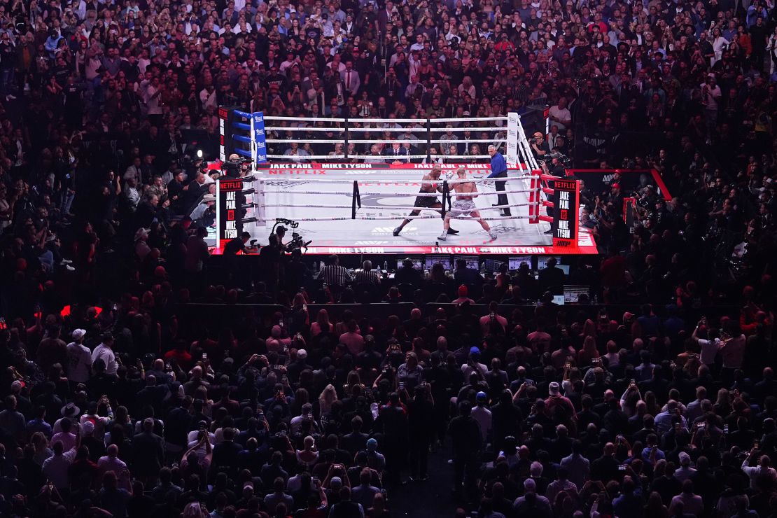 Tyson, left, and Paul fight during their heavyweight boxing match.