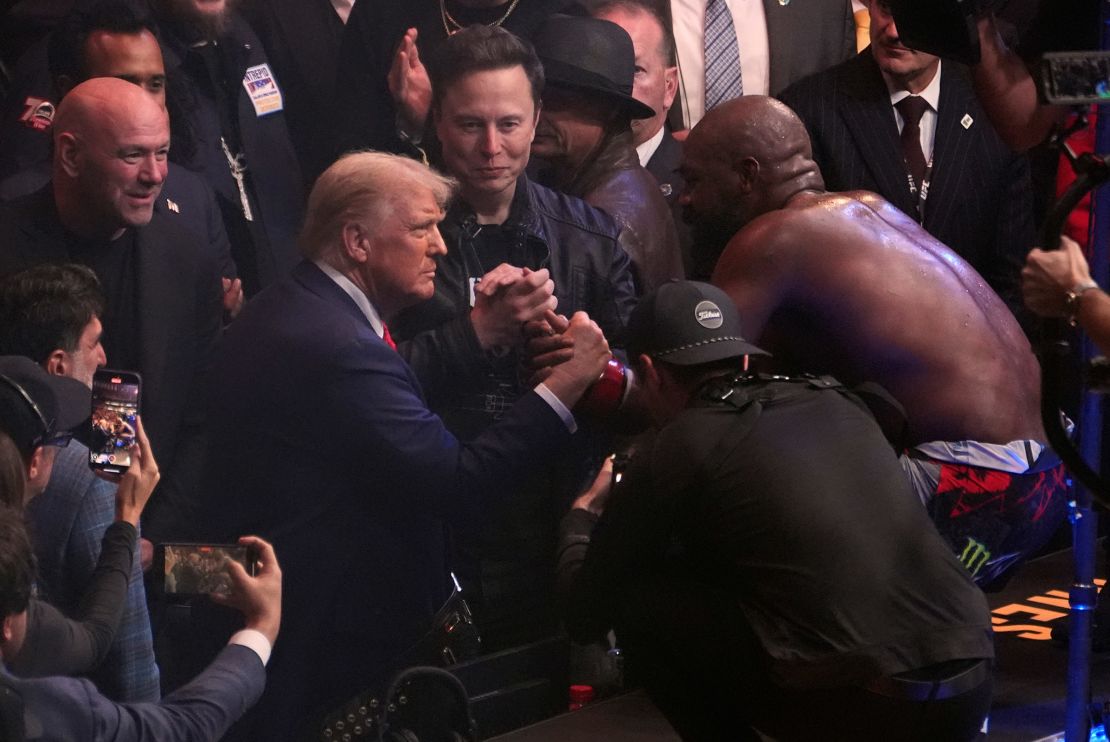 Jones (right) and Trump (left) celebrate after Jones' victory over Miocic at UFC 309.