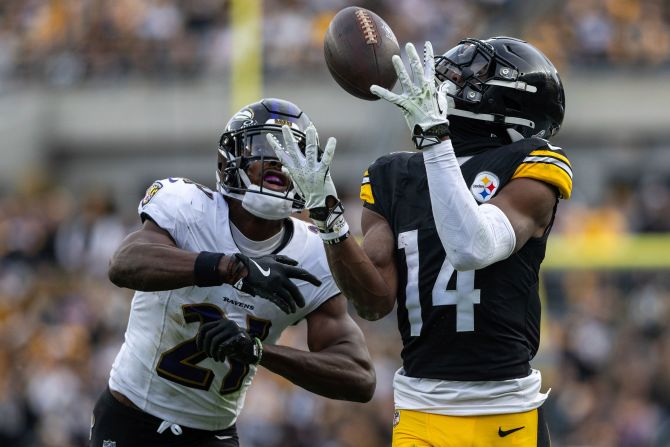 Pittsburgh Steelers wide receiver George Pickens catches a pass in front of Baltimore Ravens cornerback Brandon Stephens during his team's 18-16 victory in Pittsburgh on November 17.