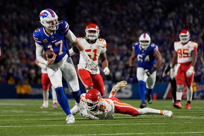 Buffalo Bills quarterback Josh Allen slips past Kansas City Chiefs cornerback Nazeeh Johnson to score on a 26-yard run near the end of the game in Orchard Park, New York, on Sunday, November 17. <a href="https://www.cnn.com/2024/11/17/sport/kansas-city-chiefs-first-loss-buffalo-bills-spt-intl/index.html">The Bills beat the Chiefs 30-21</a>, ending Kansas City’s 15-game win streak. Allen finished with 262 yards, one touchdown and one interception while adding 57 yards and a score on the ground.