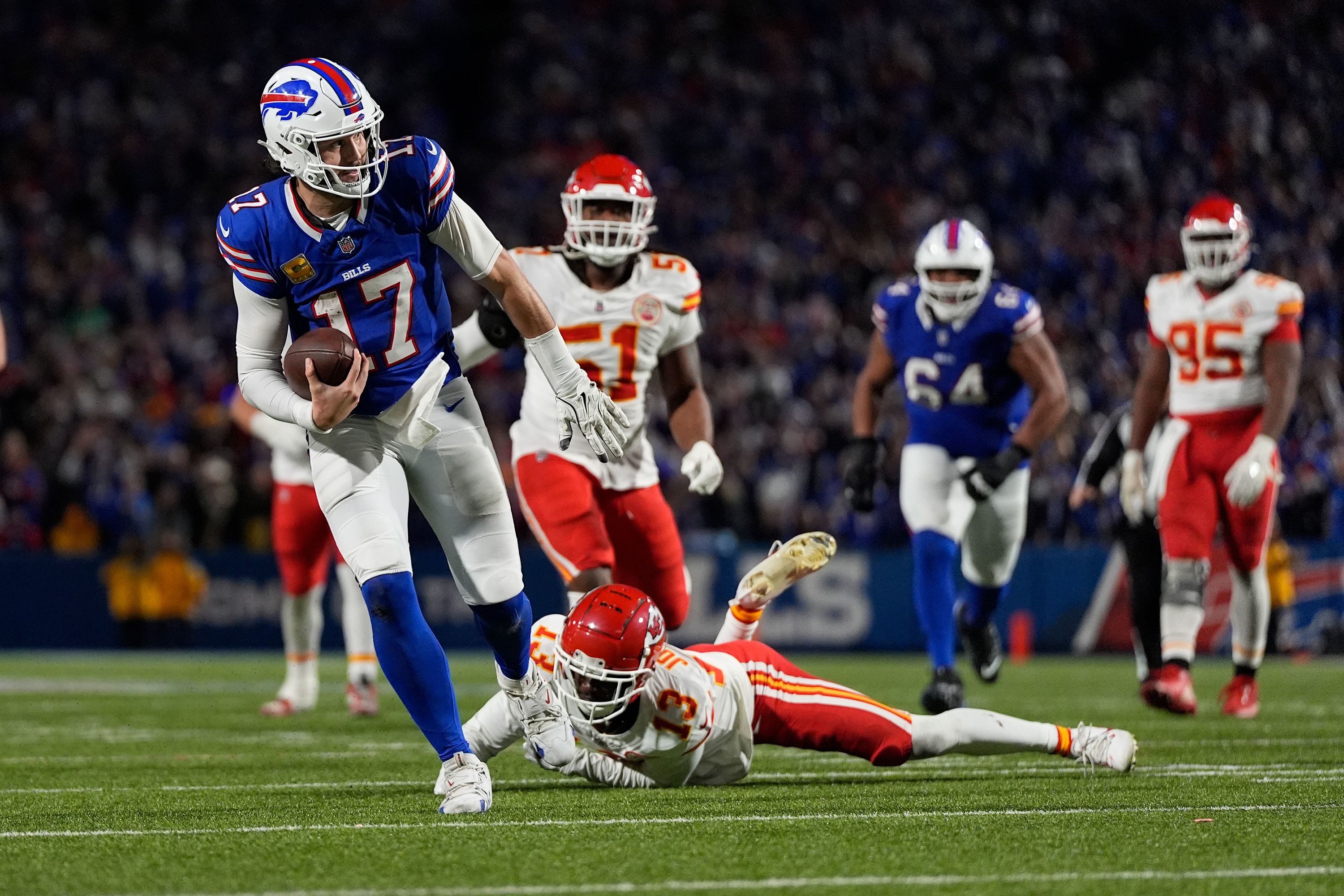 Buffalo Bills quarterback Josh Allen slips past Kansas City Chiefs cornerback Nazeeh Johnson to score on a 26-yard run near the end of the game in Orchard Park, New York, on Sunday, November 17. <a href="index.php?page=&url=https%3A%2F%2Fwww.cnn.com%2F2024%2F11%2F17%2Fsport%2Fkansas-city-chiefs-first-loss-buffalo-bills-spt-intl%2Findex.html">The Bills beat the Chiefs 30-21</a>, ending Kansas City’s 15-game win streak. Allen finished with 262 yards, one touchdown and one interception while adding 57 yards and a score on the ground.