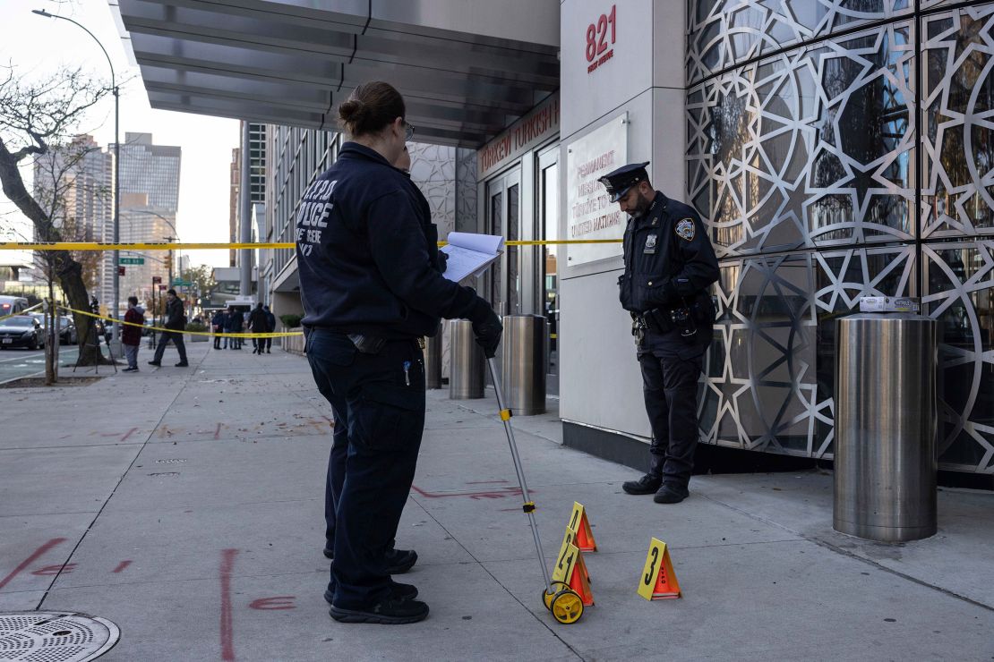 NYPD officers at the site where a suspect in a fatal stabbing spree was captured in Manhattan.