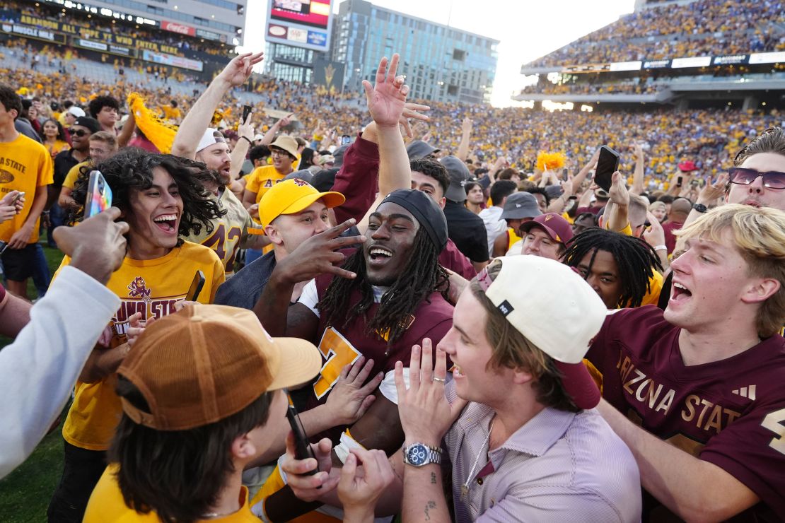 Arizona State players and fans celebrates after defeating BYU.