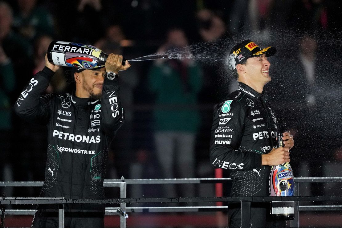 The Mercedes duo of Hamilton and Russell celebrate on the podium.