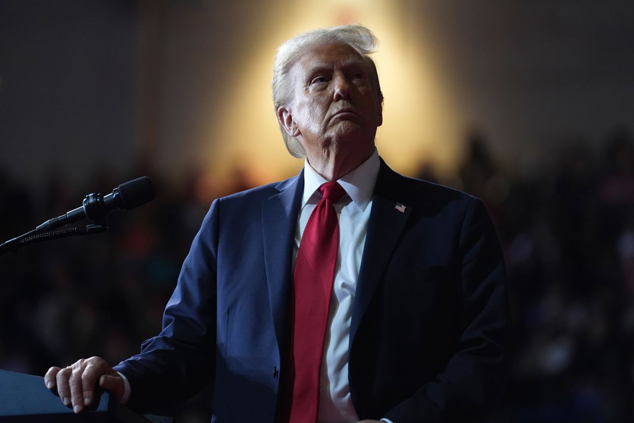 Donald Trump watches a video screen at a campaign rally, in Salem, Virginia, on November 2, 2024.