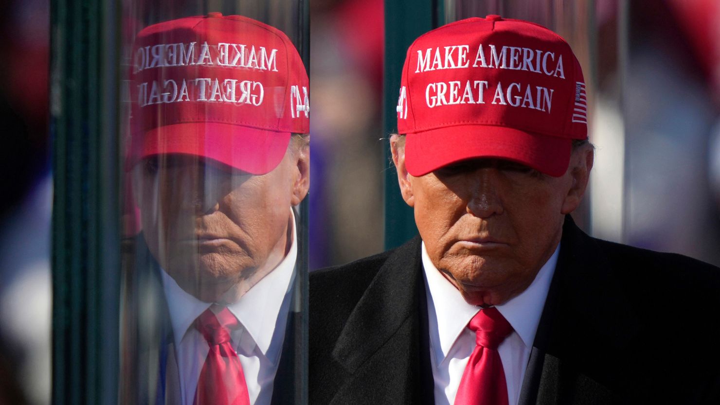 Donald Trump is reflected in bullet proof glass as he finishes speaking at a campaign rally in Lititz, Pennsylvania on November 3.