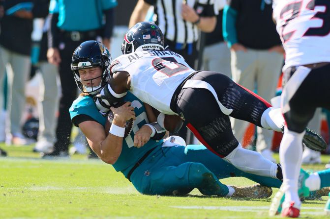 Jacksonville Jaguars quarterback Trevor Lawrence is hit by Houston Texans linebacker Azeez Al-Shaair during their game on December 1 in Jacksonville, Florida. Lawrence was <a href="index.php?page=&url=https%3A%2F%2Fwww.cnn.com%2F2024%2F12%2F01%2Fsport%2Fjacksonville-jaguars-trevor-lawrence-concussion-spt-intl%2Findex.html">ruled out with a concussion</a> after taking the late hit. Al-Shaair was ejected from the game along with Jaguars cornerback Jarrian Jones for an ensuing fight.