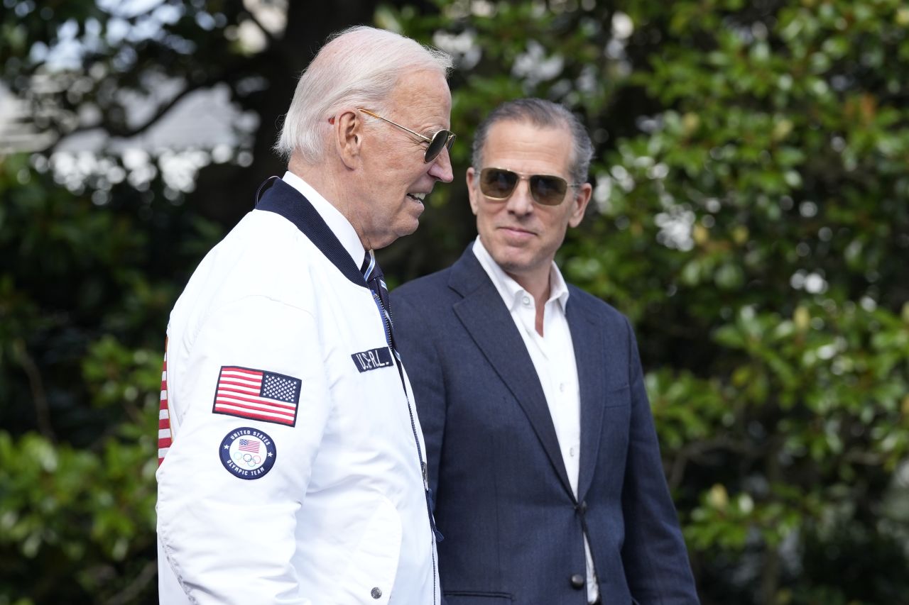 President Joe Biden walks with his son Hunter Biden toward Marine One on the South Lawn of the White House in July.