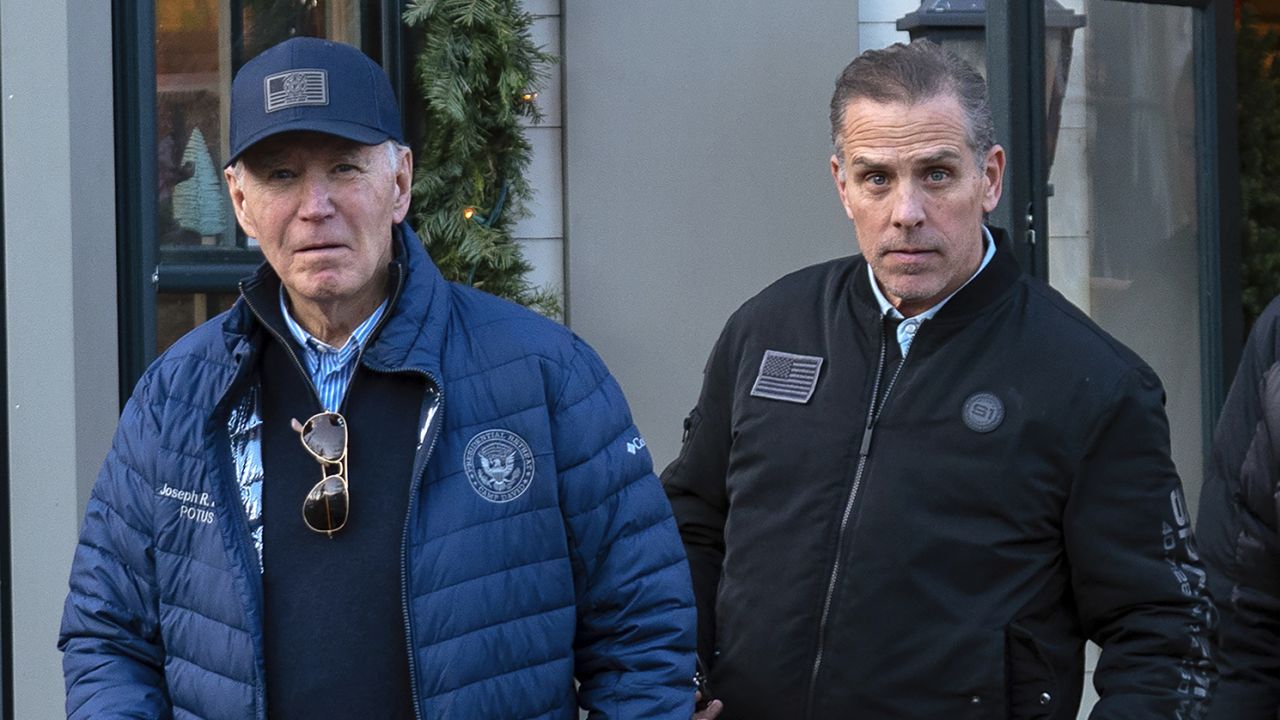 President Joe Biden and his son Hunter Biden walk in downtown Nantucket Massachusetts, on November 29, 2024.