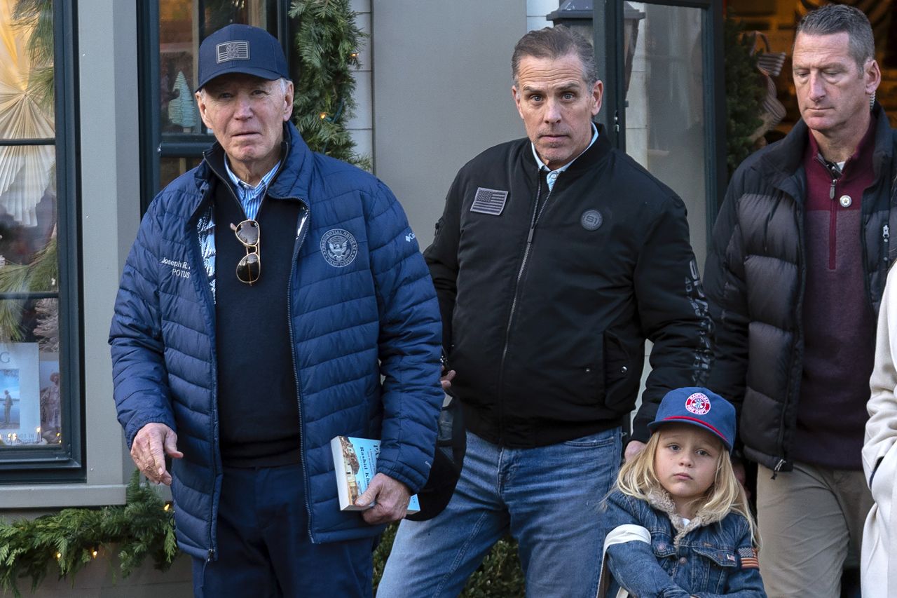 President Joe Biden is accompanied by his son Hunter Biden and his grandson Beau as they leave a book store in Nantucket, Massachusetts, on November 29.