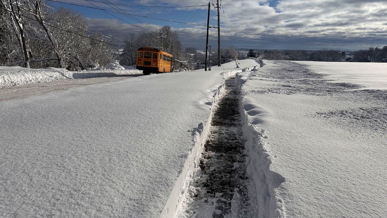 A school bus is on a delayed schedule after a snow storm in Lowville, N.Y., Monday, Dec. 2, 2024. (AP Photo/Cara Anna)