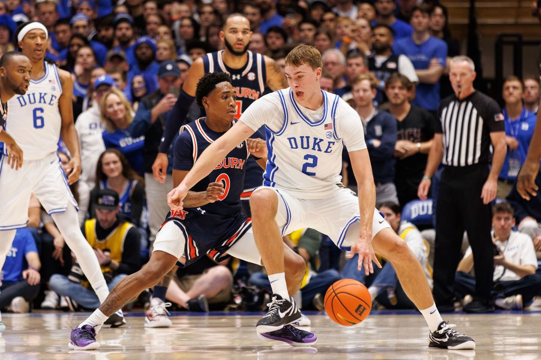 Duke's Cooper Flagg takes the ball while Auburn's Tahaad Pettiford defends at Cameron Indoor Stadium.