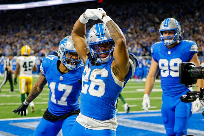 Detroit Lions running back Jahmyr Gibbs celebrates after a touchdown catch against the Green Bay Packers in Detroit on Thursday, December 5. The Lions clinched a spot in the playoffs with their 34-31 win.