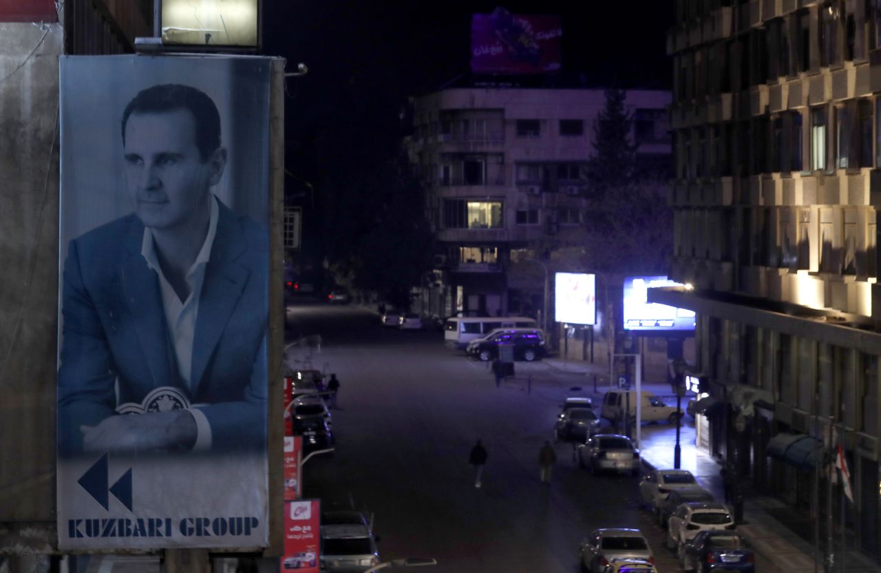 A portrait of Syrian President Bashar al-Assad is seen on a building in Damascus, Syria, on December 7.