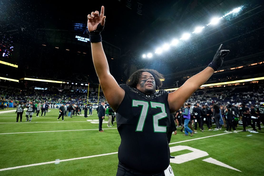 Oregon offensive lineman Iapani Laloulu celebrates after the Big Ten championship NCAA college football game against Penn State, Saturday, Dec. 7, 2024, in Indianapolis.