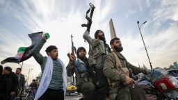 syrian opposition fighters celebrate after the syrian government collapsed in damascus, syria, sunday, dec. 8, 2024. (ap photo/omar sanadiki)
