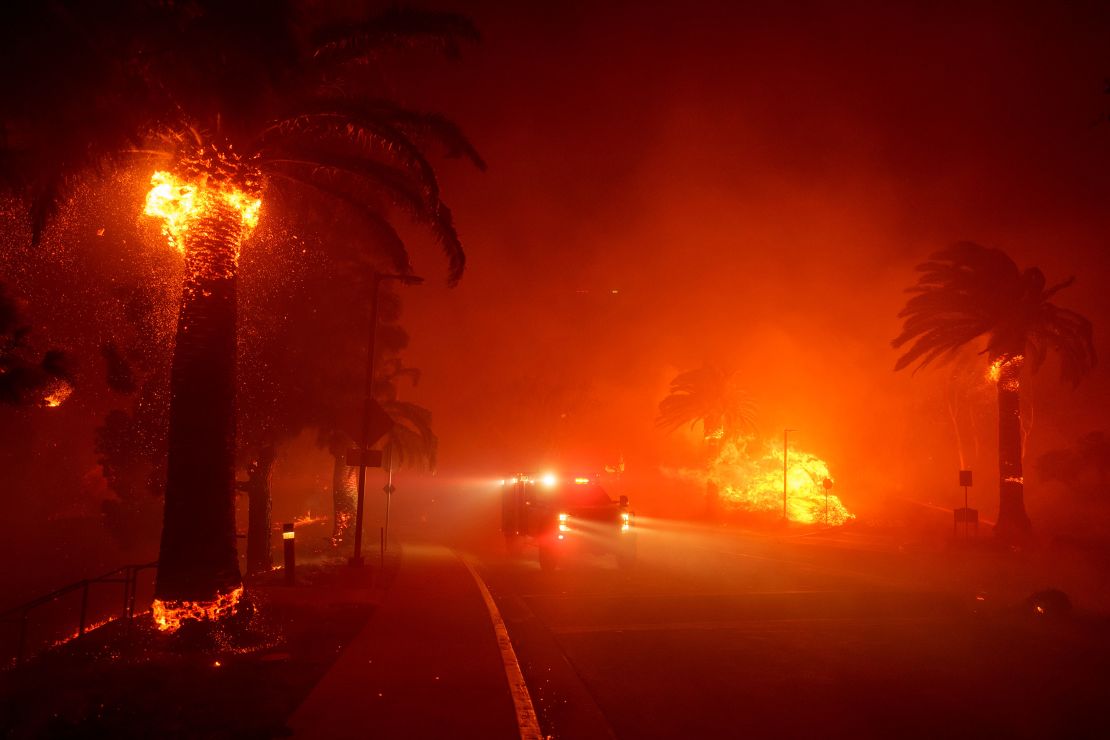 Firefighters drive through Pepperdine University as the Franklin Fire approaches.