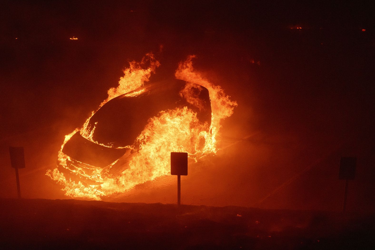 A vehicle burns on the Pepperdine campus on Tuesday.