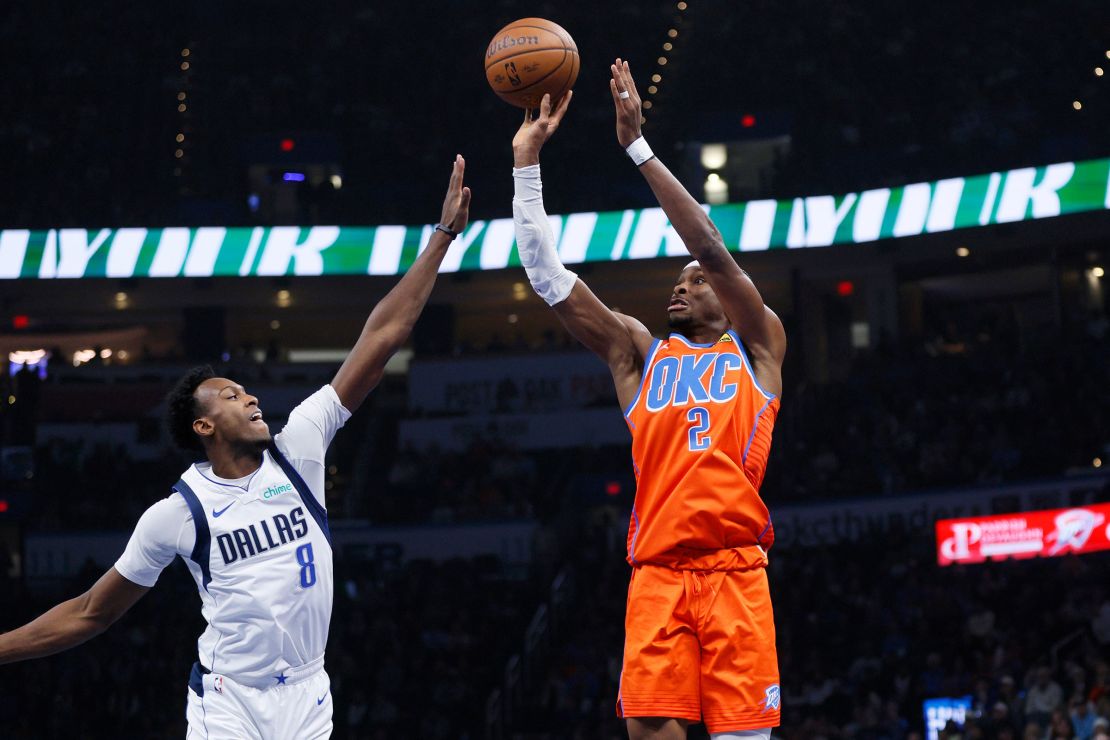 Oklahoma City Thunder guard Shai Gilgeous-Alexander shoots a three-pointer against the Dallas Mavericks.