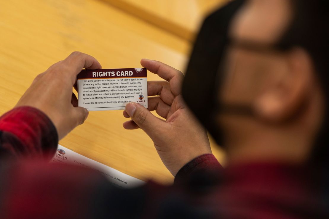 A participant holds a "rights card" during a bilingual workshop for immigrants on December 4 at the office of the Coalition for Humane Immigrant Rights in Los Angeles.