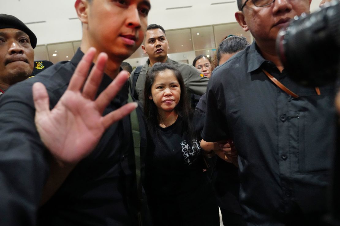 Mary Jane Veloso is escorted by Indonesian officials upon arrival at Soekarno-Hatta International Airport for her repatriation to the Philippines, in Tangerang, Indonesia, on December 17, 2024.